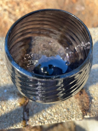 JP 5” amethyst art glass goblet with an optic swirl pattern and a short footed base