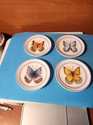 Set of four beautiful four and a half inch.Butterfly plates set of four