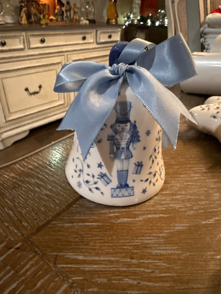 Blue ceramic nutcracker ornament with satin bow|140326