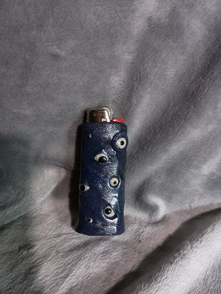 So many eyes! Glow in the dark lighter cover