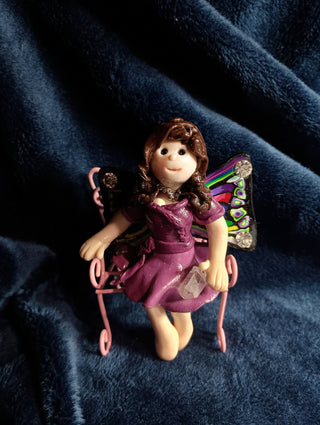 Colorful fairy with butterfly bench
