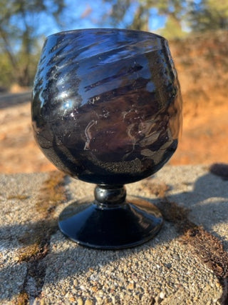 JP 5” amethyst art glass goblet with an optic swirl pattern and a short footed base