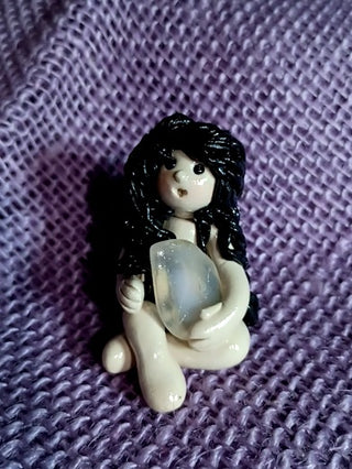 Black hair goddess with stone