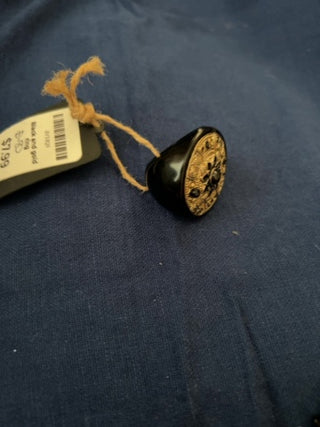Large black and gold ring