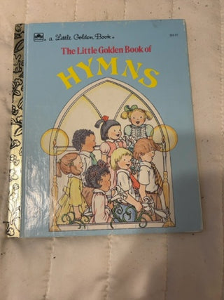 vintage 1985 edition of "The Little Golden Book of Hymns”