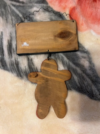 KW wooden sign painted with the word "Gingerbread" wooden gingerbread figure