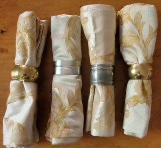 2 PIECE TAN GOLD NAPKINS/BRASS OR SILVER HOLDER