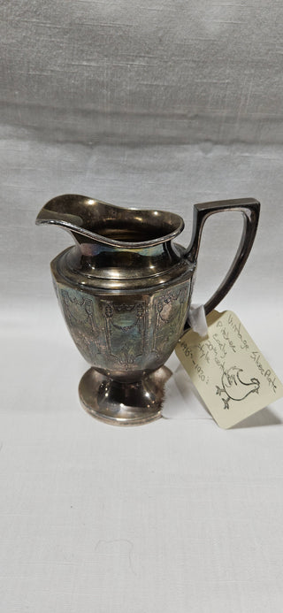 Vintage Silverplate Pitcher
4.5" tall
Decorative engraved design
Unmarked
Good vintage condition