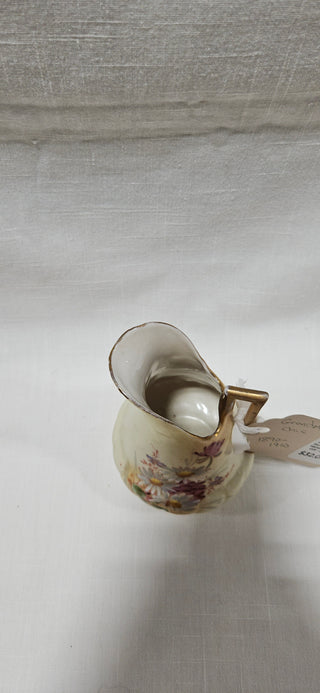 Antique Floral Porcelain Ewer
Hand-Painted · Gilt · c. 1900