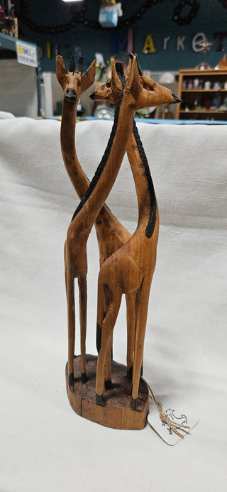 Hand-Carved Wooden Giraffe Trio
Solid wood sculpture