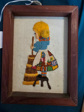 Vintage cross stitch girl churning