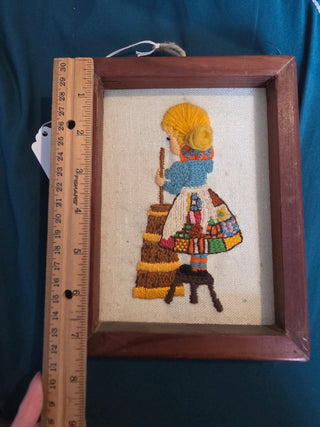 Vintage cross stitch girl churning