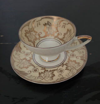 2 pc gold tan tea cup and saucer