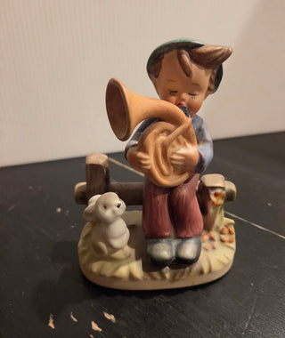 Boy Playing Horn Rabbit Figurine
