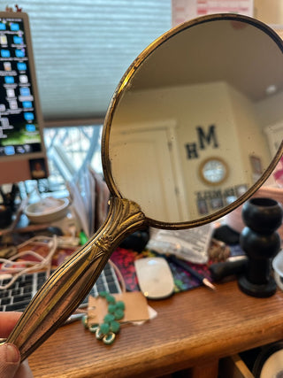 Vintage (1940-50) Gold tone oval mirror w/rose decor on back, w/handle 13.75"|61816