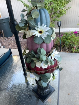 Three tiered pumpkin floral statue arrangement