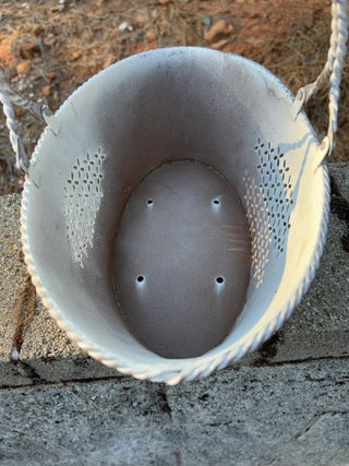 distressed white metal oval basket punch out details