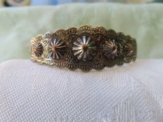 Silver tone cuff bracelet w/conchos RCD|122503