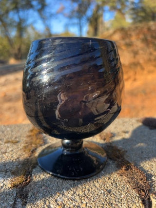 JP 5” amethyst art glass goblet with an optic swirl pattern and a short footed base