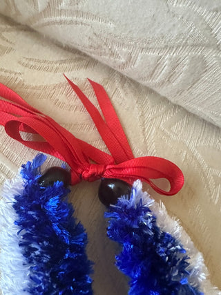 Handmade Hawaiian Eyelash Yarn Lei, Blue & white, w/kukui nut at Ribbon RCD