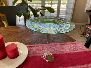 Green Depression Glass plate on  glass stand
