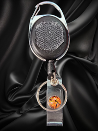Carabiner with Belt Clip Interchangeable Badge Reel with Retractable Reel. Badge Button: Orange & Black Shine. Our Interchangeable Badge Reels are made to be used with our Interchangeable Badge Reel Charms.|63928