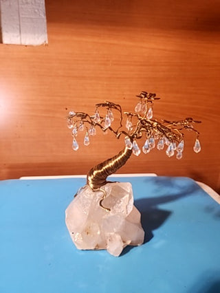 Beautiful handmade swarovski crystal tree on a huge quartz crystal base