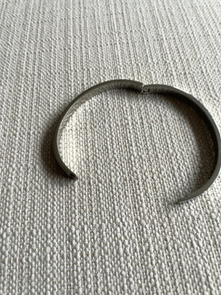 Silvertone bangle bracelet with clear crystals