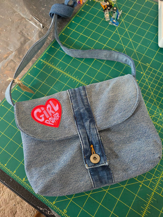 Recycled bag with waistband button closure