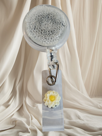 Belt Clip Interchangeable Badge Reel with Retractable Reel. Badge Button: Cream Flower Our Interchangeable Badge Reels are made to be used with our Interchangeable Badge Reel Charms.|63705