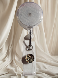 Alligator Swivel Clip Interchangeable Badge Reel with Retractable Reel. Badge Button: Cheetah Print. Our Interchangeable Badge Reels are made to be used with our Interchangeable Badge Reel Charms.|63751