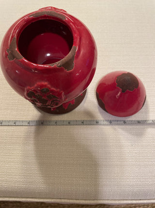 Red decorative jar with lid