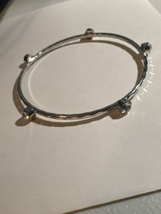 silver colored bangle with clear stones