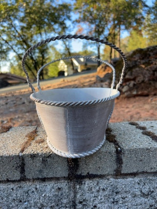 distressed white metal oval basket punch out details