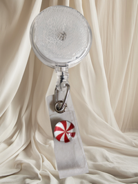 Alligator Swivel Clip Interchangeable Badge Reel with Retractable Reel. Badge Button: Peppermint Swirl. Our Interchangeable Badge Reels are made to be used with our Interchangeable Badge Reel Charms.|63741