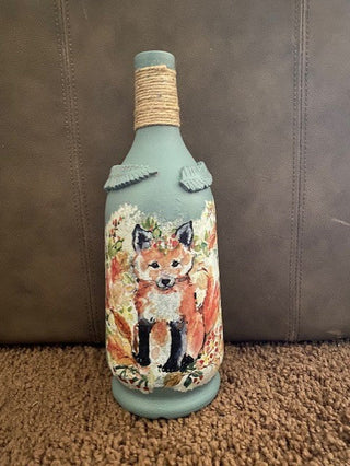 Tall bottle vase with 2 foxes