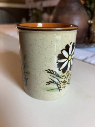 JP vintage 1970s speckled stoneware coffee mug with a white daisy