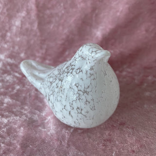 small white glass bird
