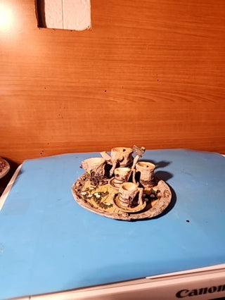 Miniature t set designed to look like tree stumps and wood great for collectible or fairy gardens