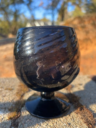 JP 5” amethyst art glass goblet with an optic swirl pattern and a short footed base
