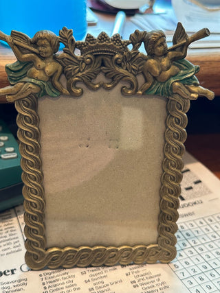 Vtg. Pewter-tone Picture frame. enamel cherub design 5" x 3.5"