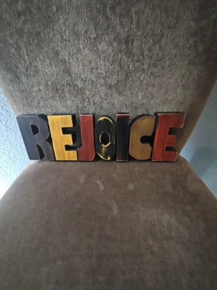 Multi-Colored Wooden Rejoice Sign