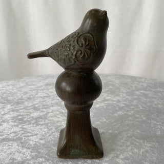 brown ceramic bird on pedestal RSV