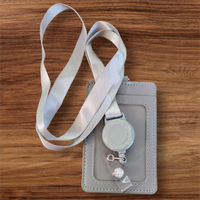 Interchangeable Badge Reel Lanyard with Retractable Reel: Lanyard Gray. Badge Button: Silver Shine. Our Interchangeable Badge Reels are made to be used with our Interchangeable Badge Reel Charms.|63681