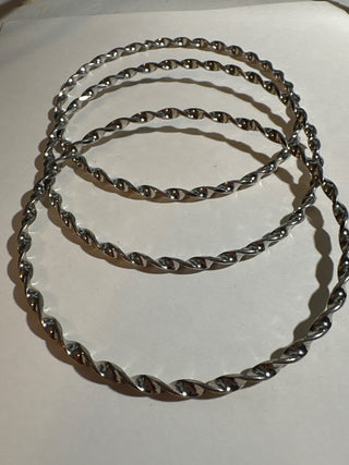 3 silver colored bangles