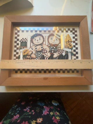 Raggedy Ann and Andy sitting on a bench, song by  Laurie Korsgaden.