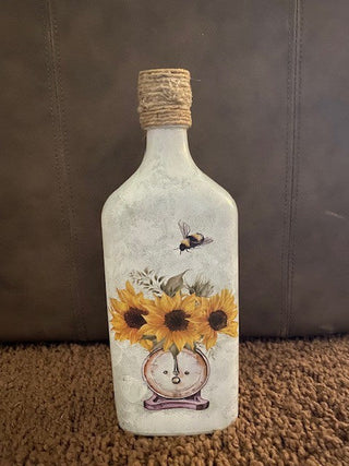Vase with daisies and scale