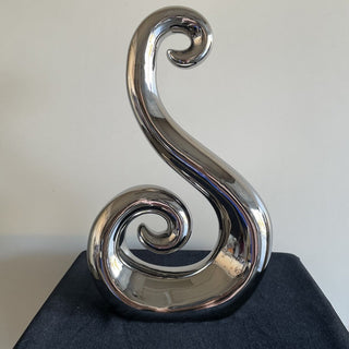 swirly silver metal sculpture RSV