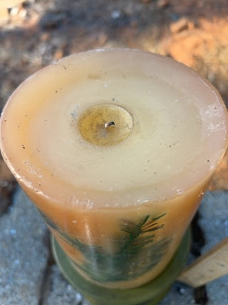 JP Pier One decorative botanical pillar candle featuring embedded olive-green pedestal holder