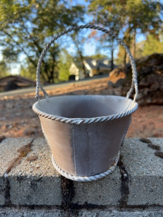 distressed white metal oval basket punch out details